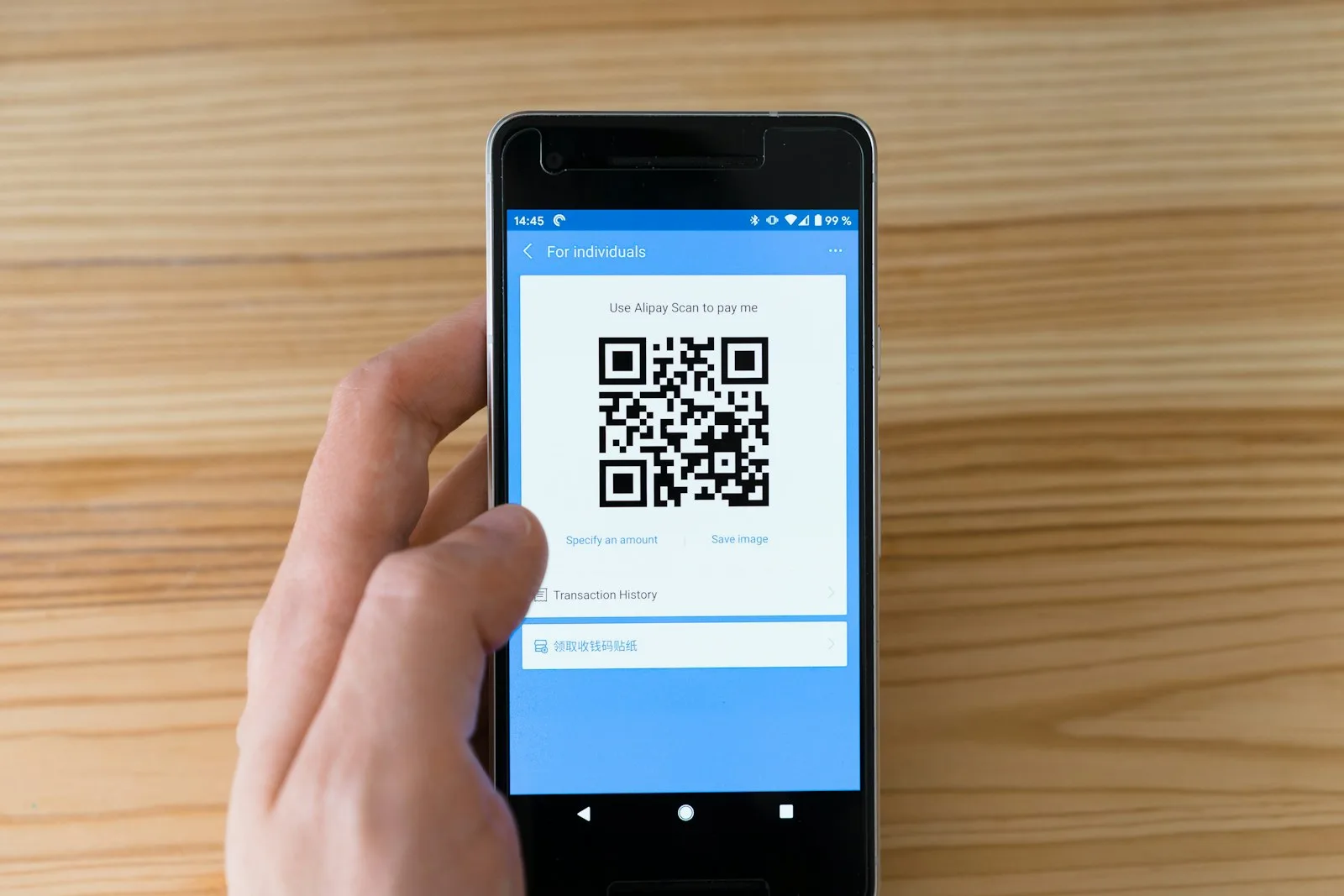A person setting up automatic bill payment on his mobile phone for one of his regular bills