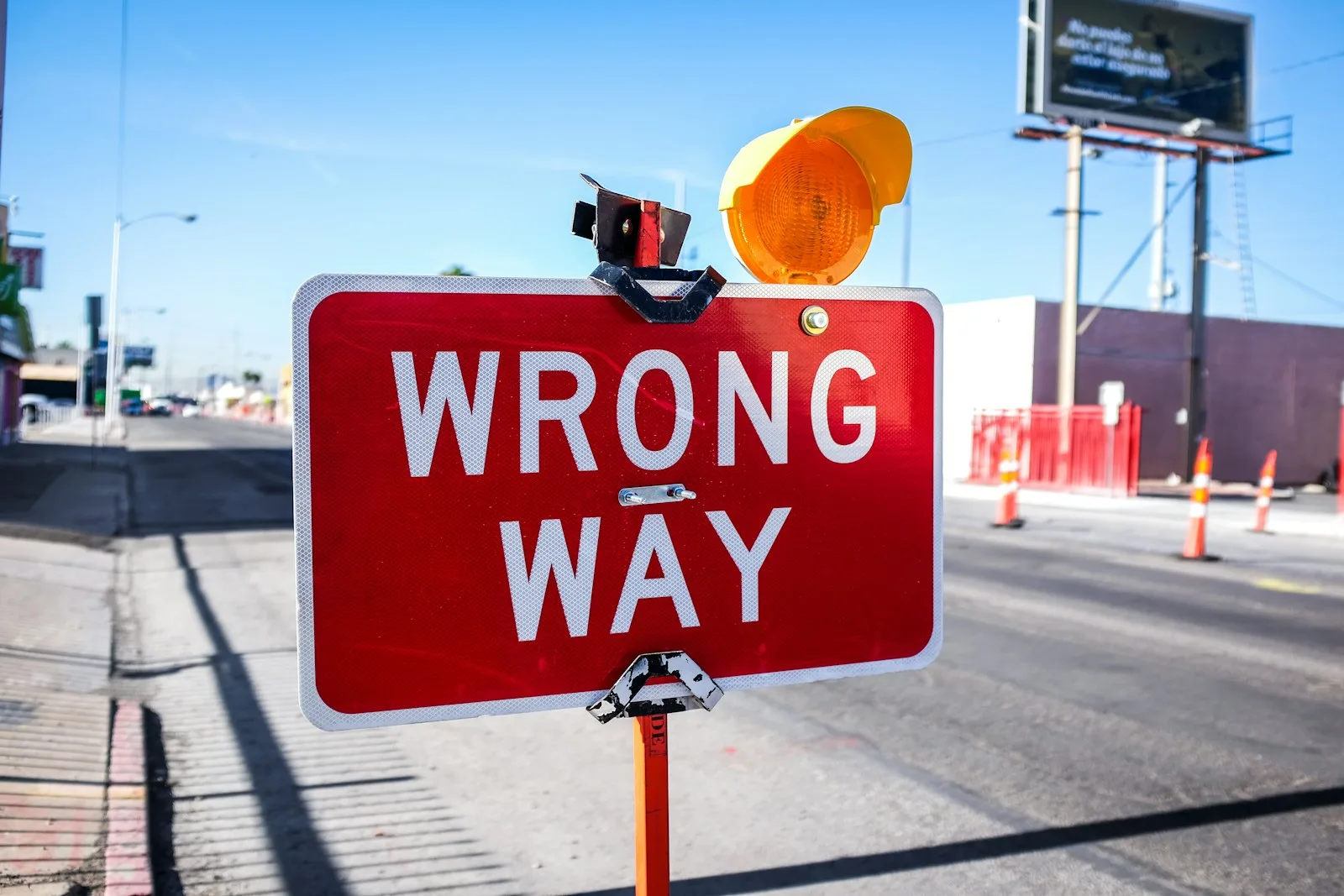 A sign board stating the word “Wrong Way”