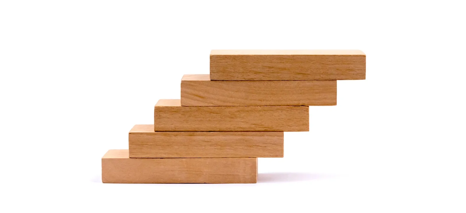 Blocks of wood depicting progress