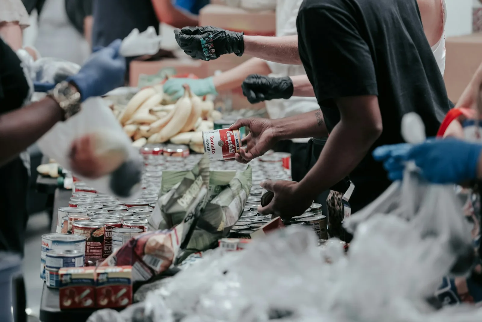 A group of people giving out household items as part of charity