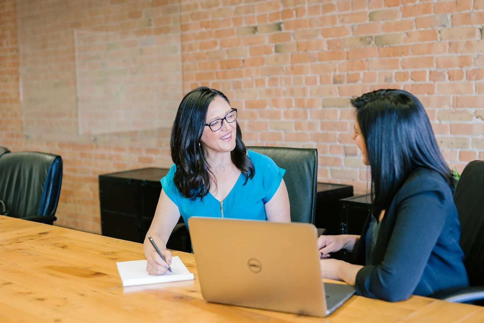 A lady taking help of a professional financial planner to get better understanding of their family’s financial situation