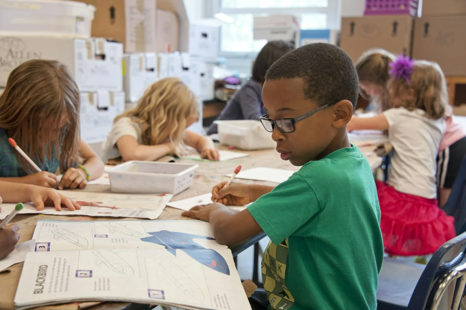 Photo of a group of kids studying in a elementary school
