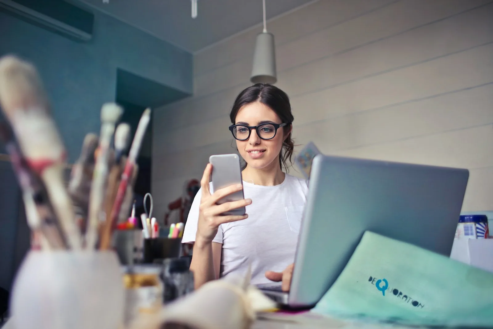 A girl trying to consolidate all her loans through research on her phone.