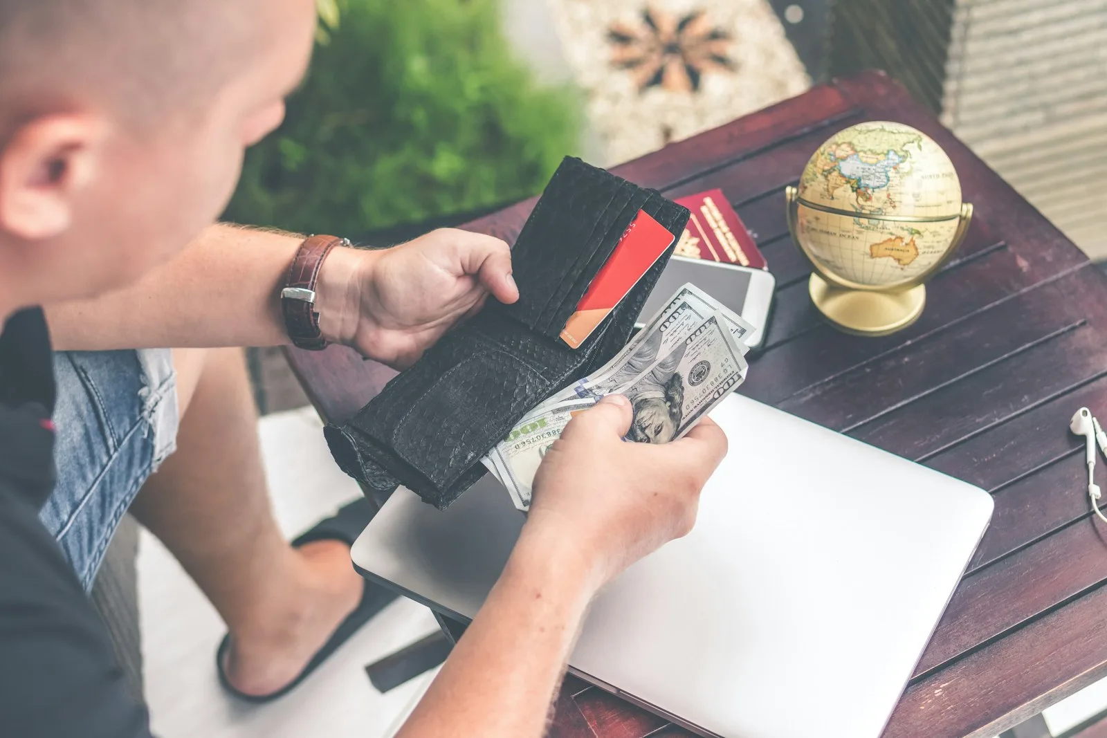 An image of a person looking overwhelmed while paying debts