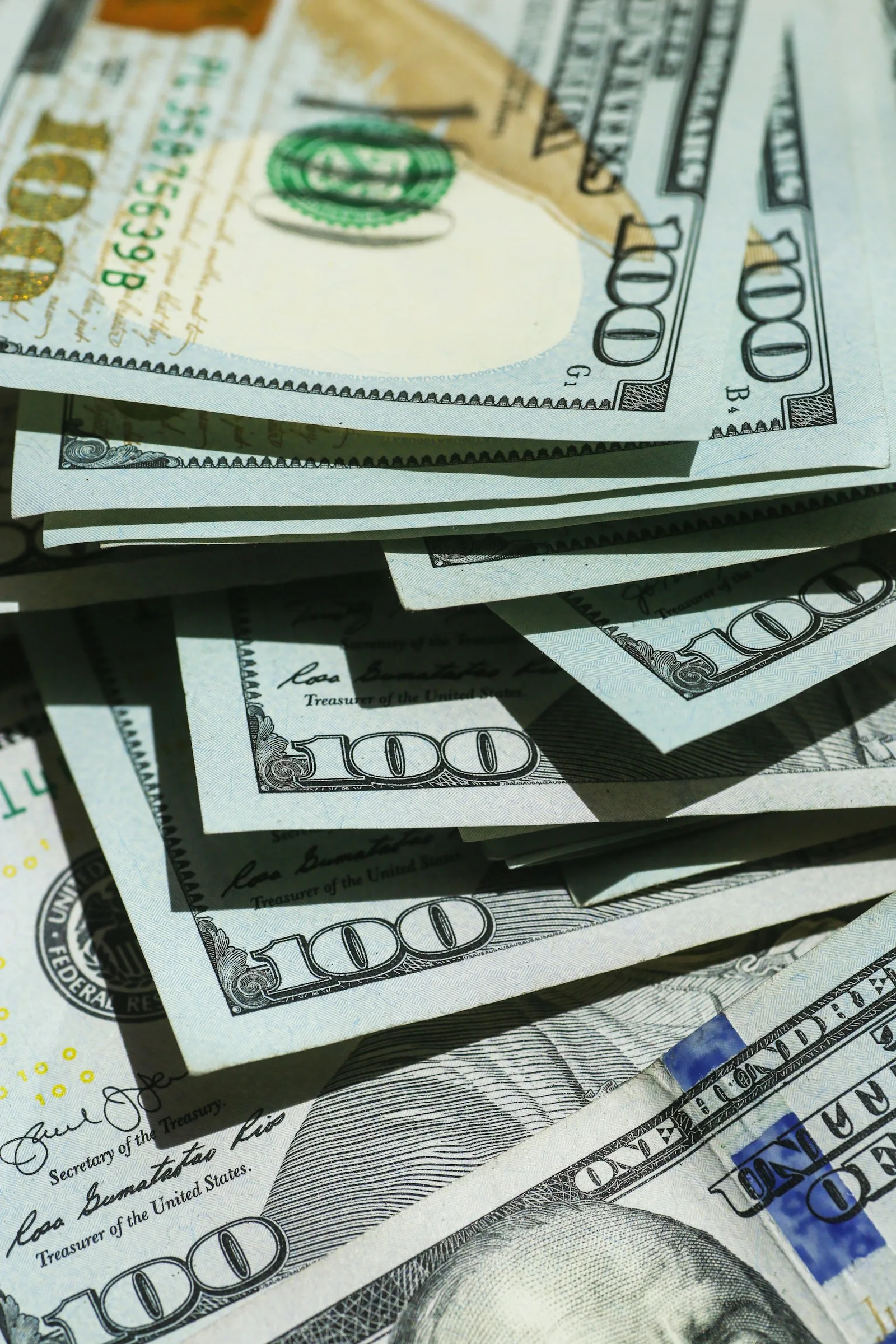 Stacks of 100 dollar bills lying around