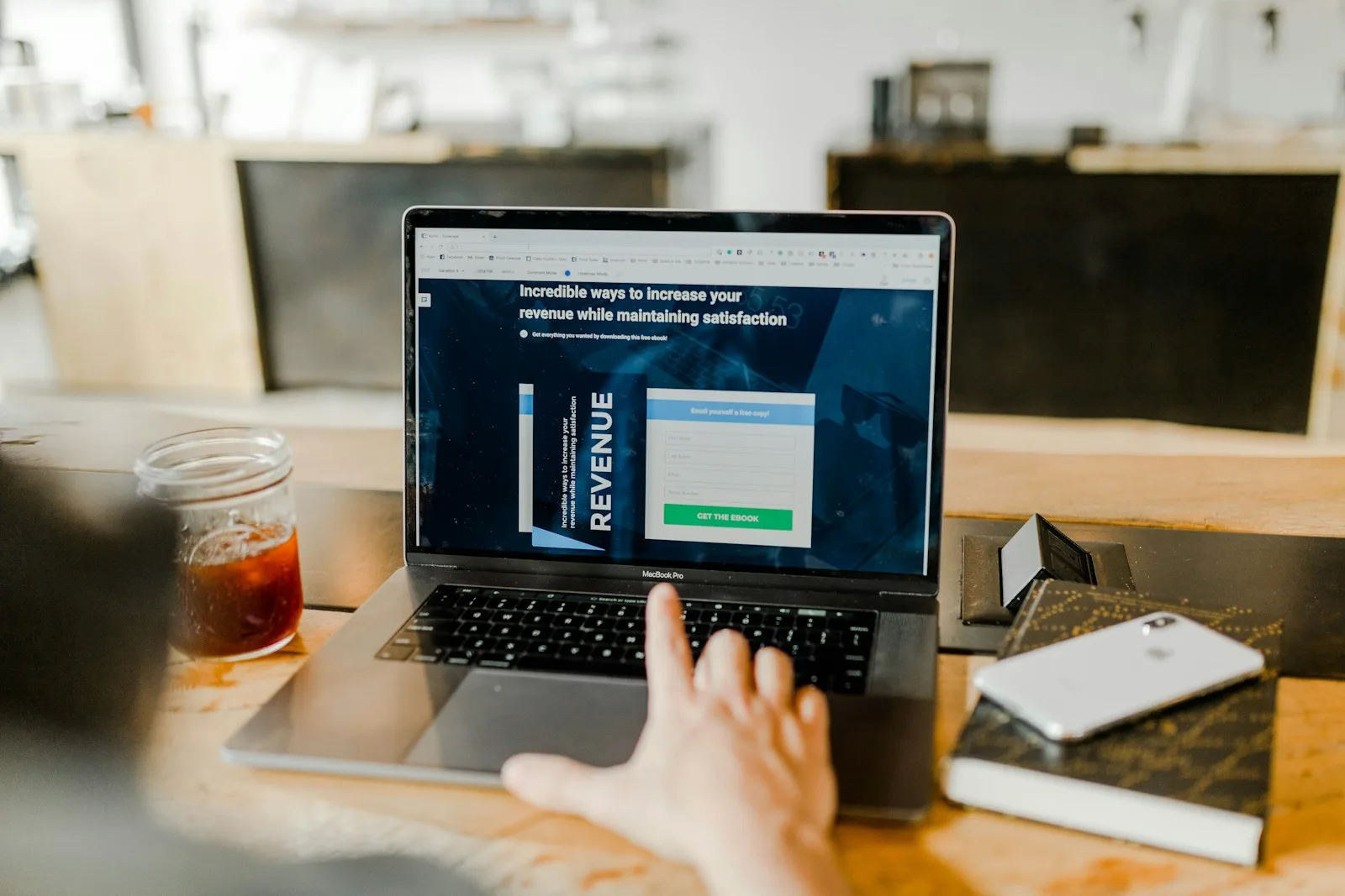 Photo of a person trying to figure out ways of increasing his / her revenue by researching online