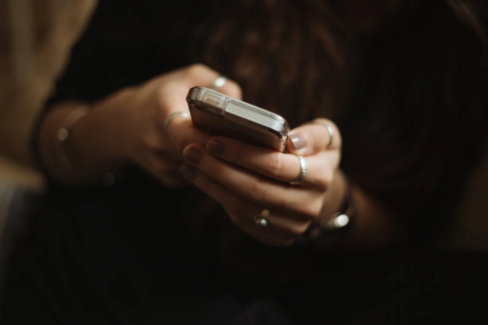 A college student comparing prices on a smartphone