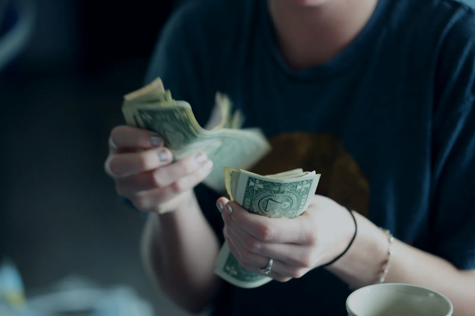 A person counting cash after taking a peer-to-peer lending offer