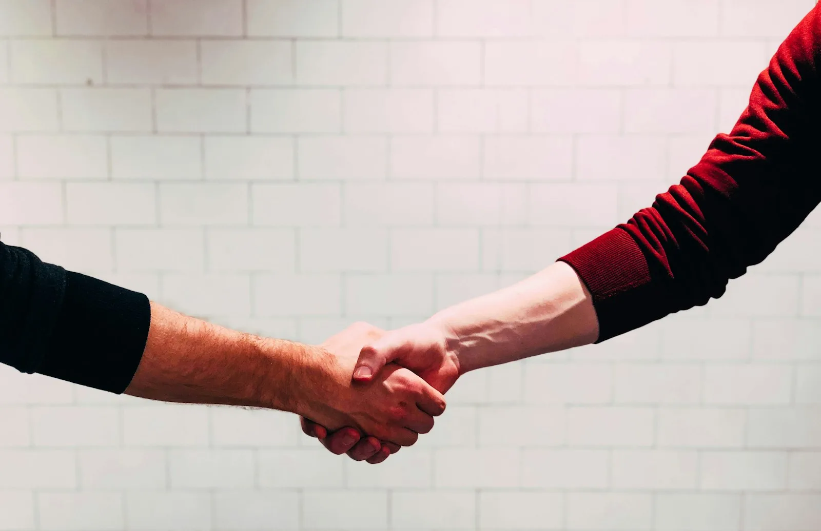 Photo of two people negotiating