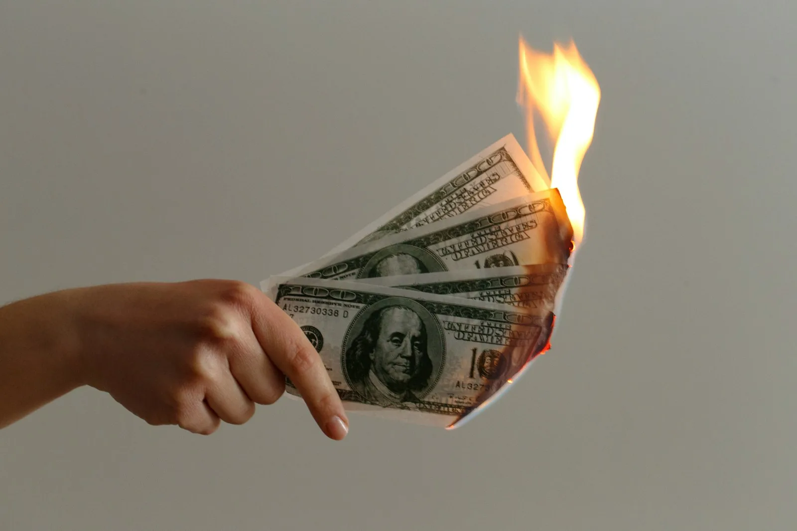 Image of $100 bills on fire