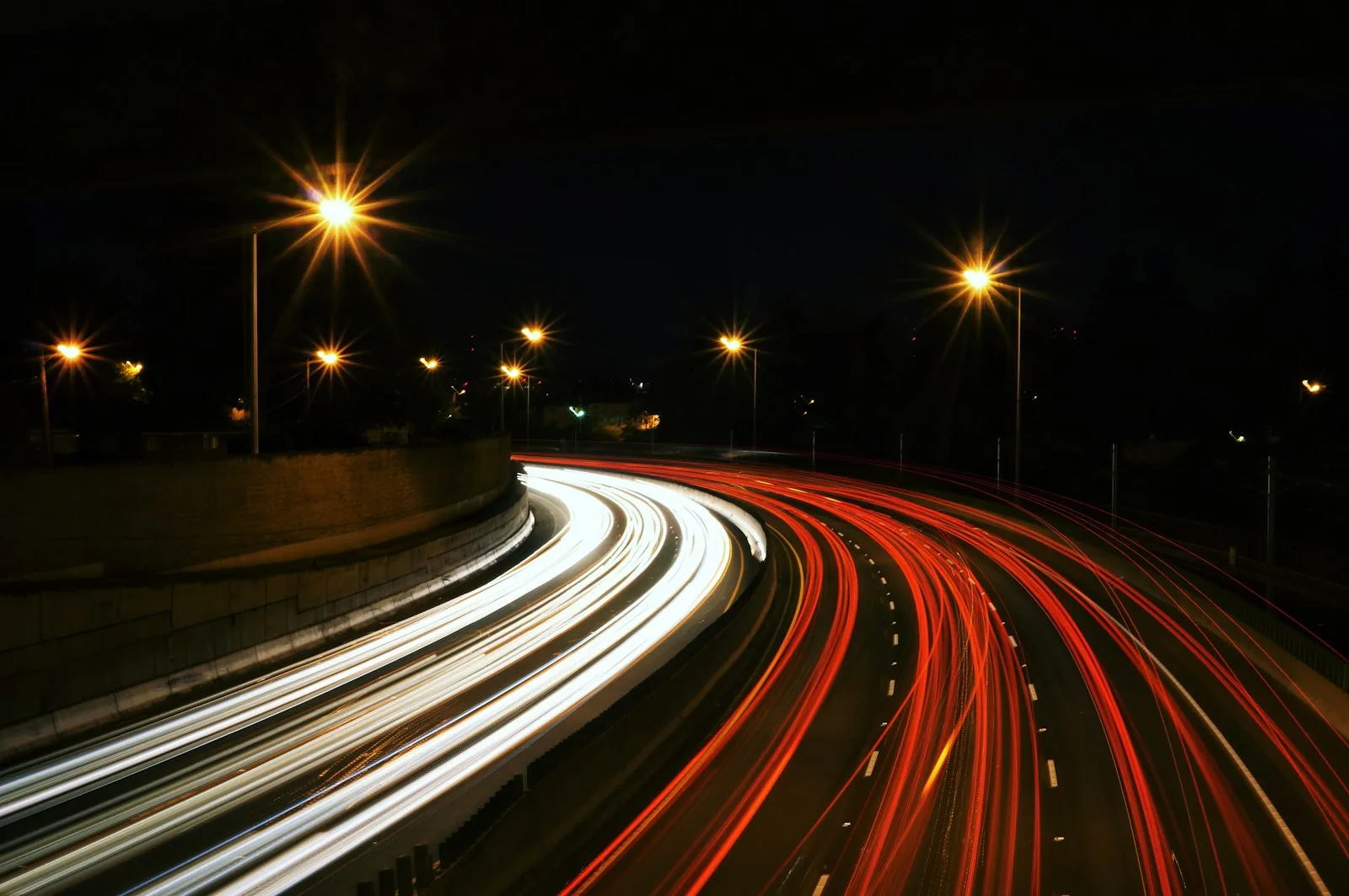Lights on the street shot with long exposure, which depicts the fast paced life