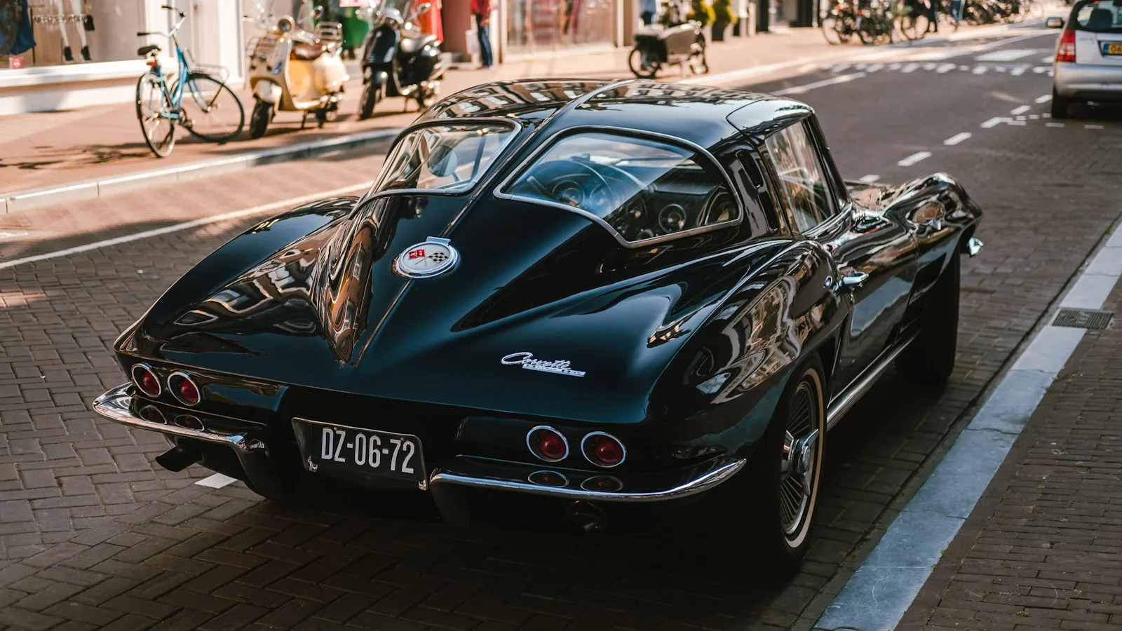 A black Corvette on a brick cobbled street