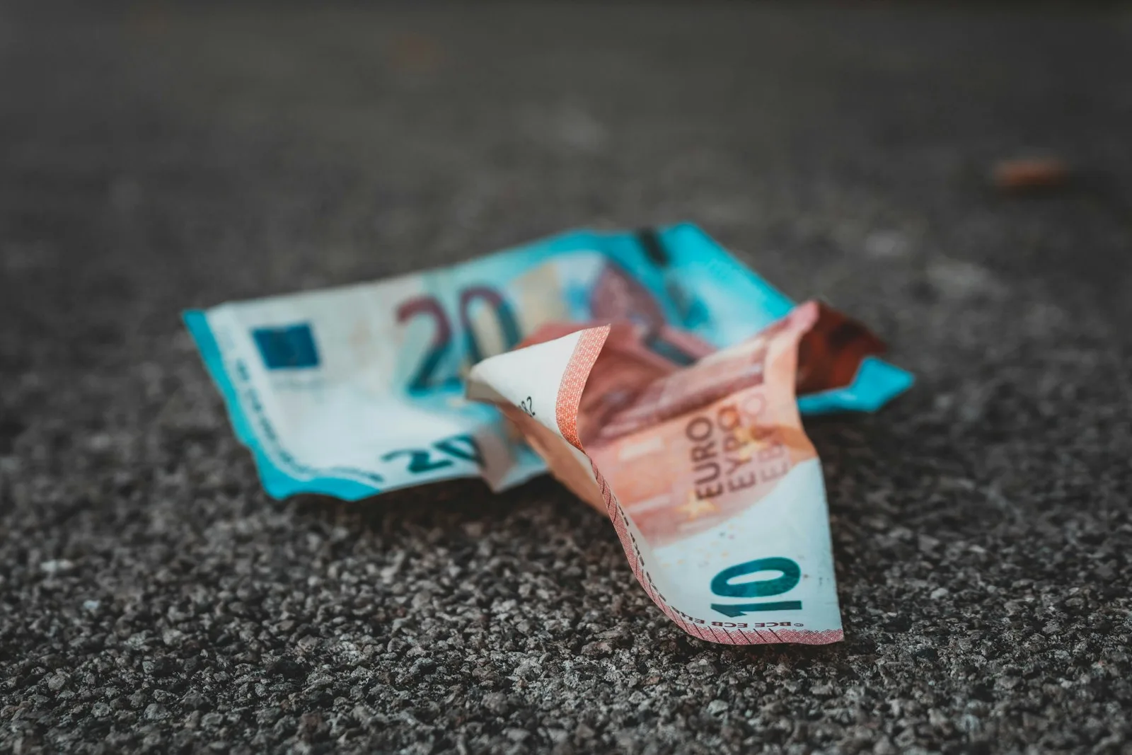 Photo of euro bills getting crumpled, a sign of money loosing it’s value or inflation