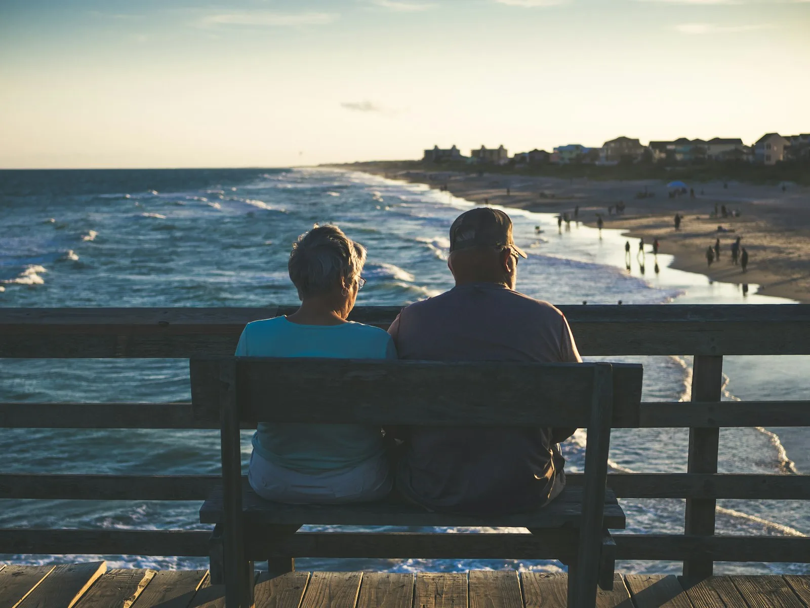 Photo of a couple enjoying retired life by the beach