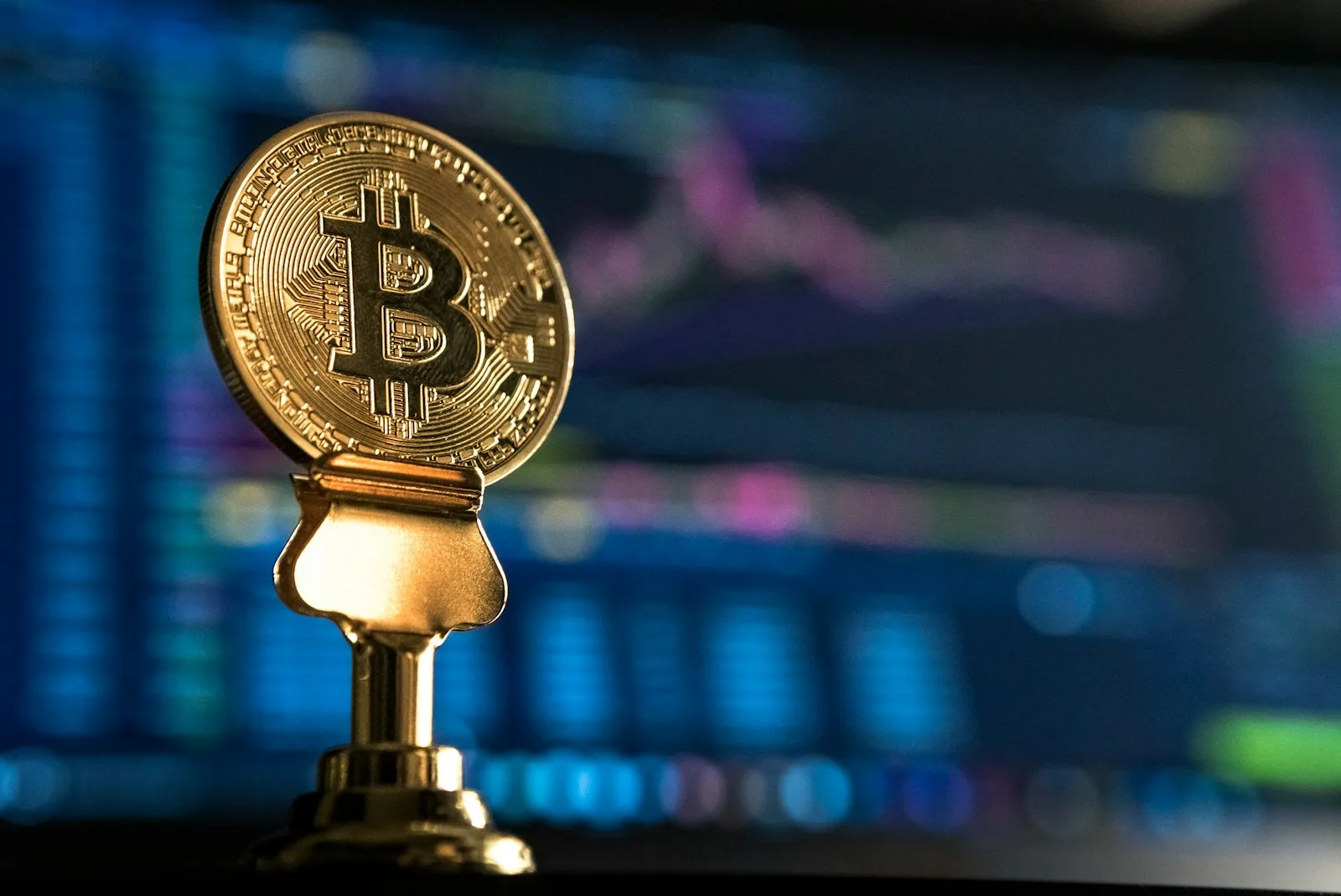 Photo of BitCoin symbol embedded over a key
