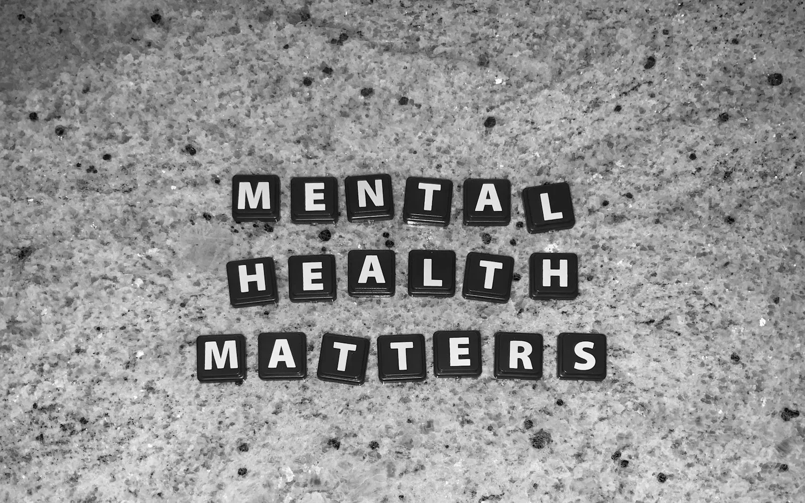 Blocks of letters forming the word “Mental Health Matters”