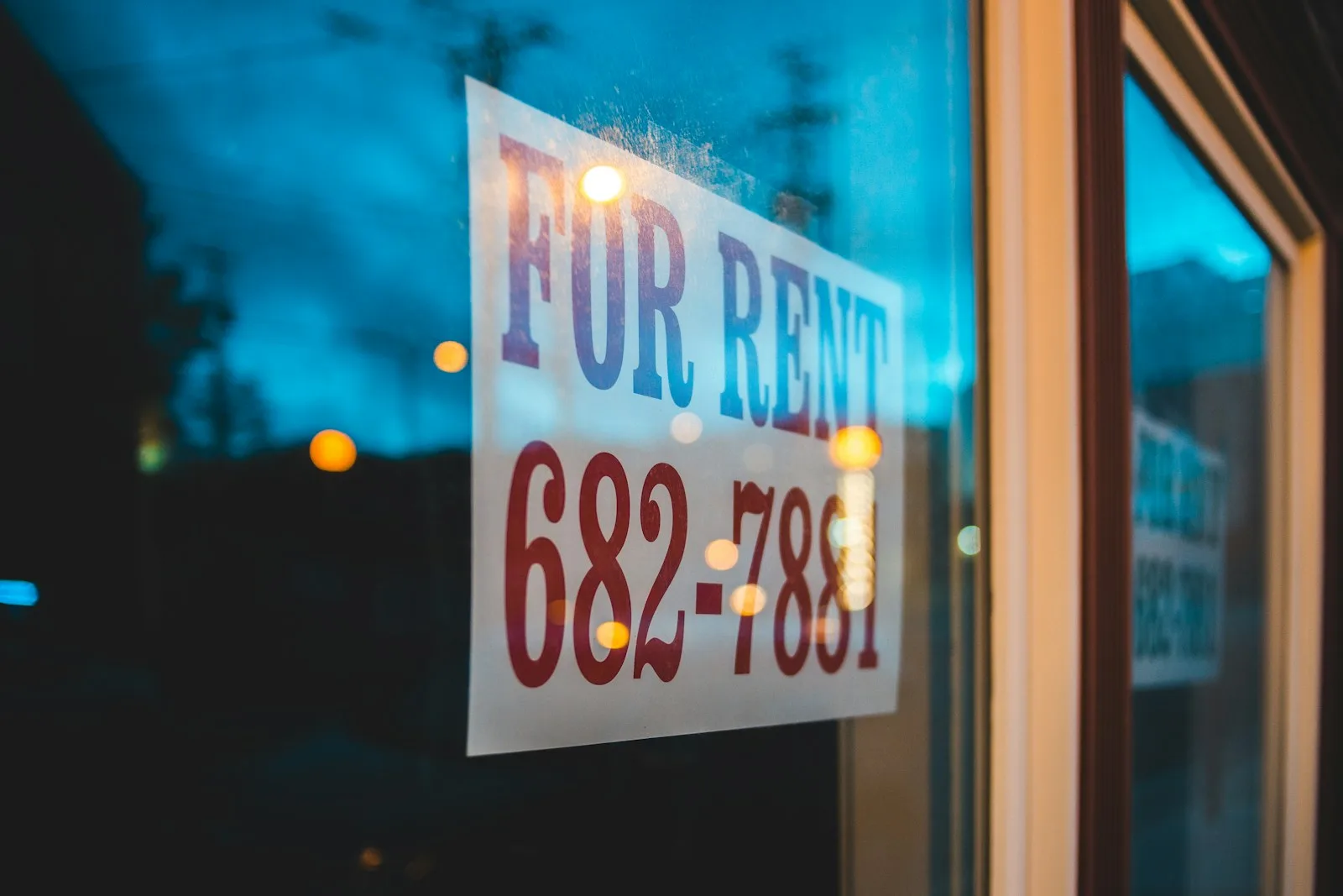 A signboard stating that the property is up for rent.