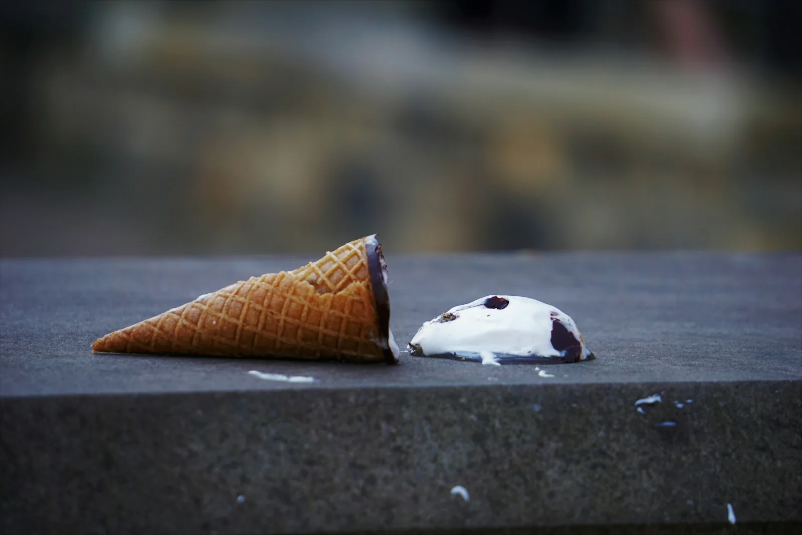 Image of someone who’s spilled over an ice cream cone by mistake