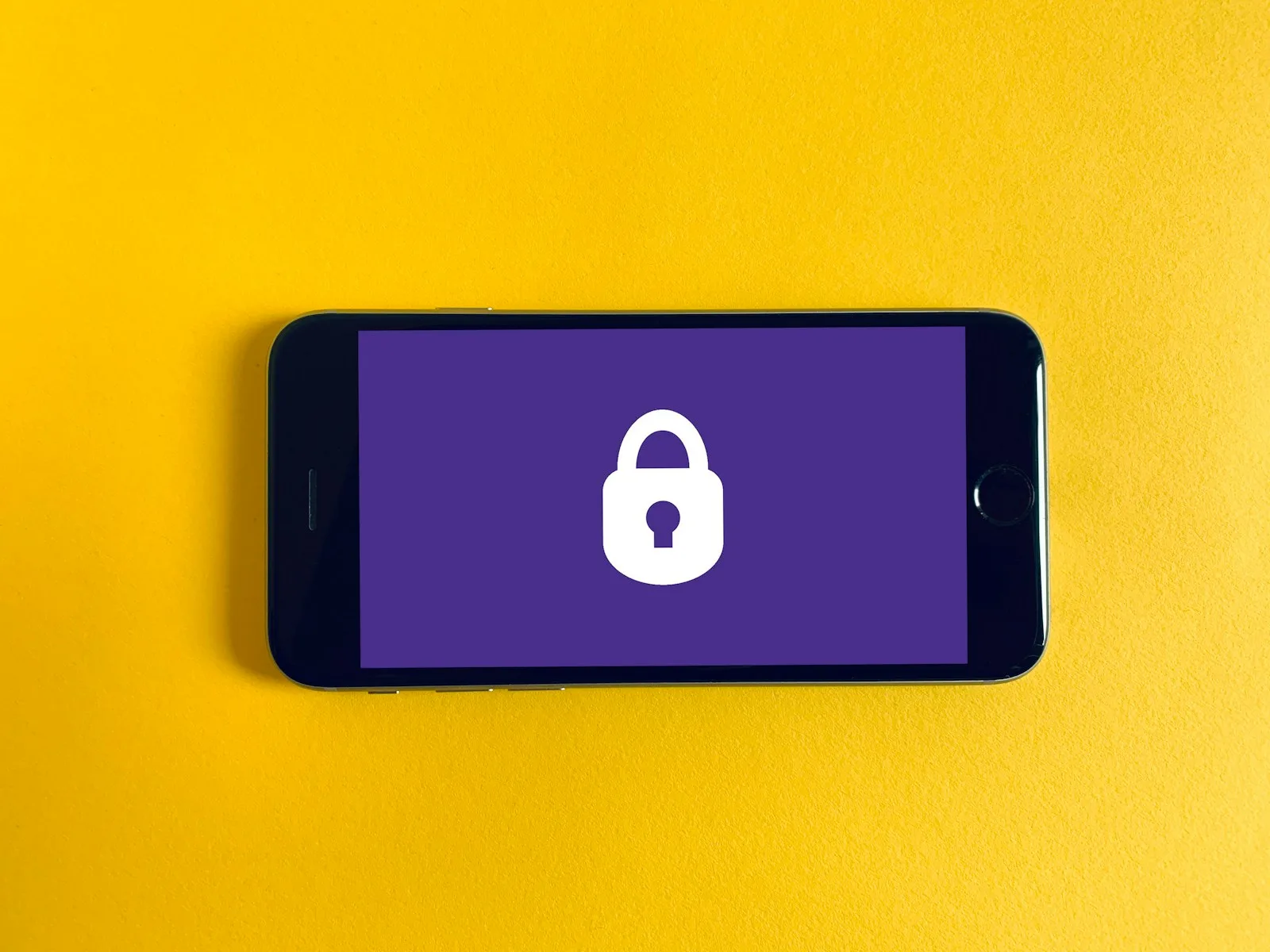 Photo of a mobile phone with the sign of a lock on it.