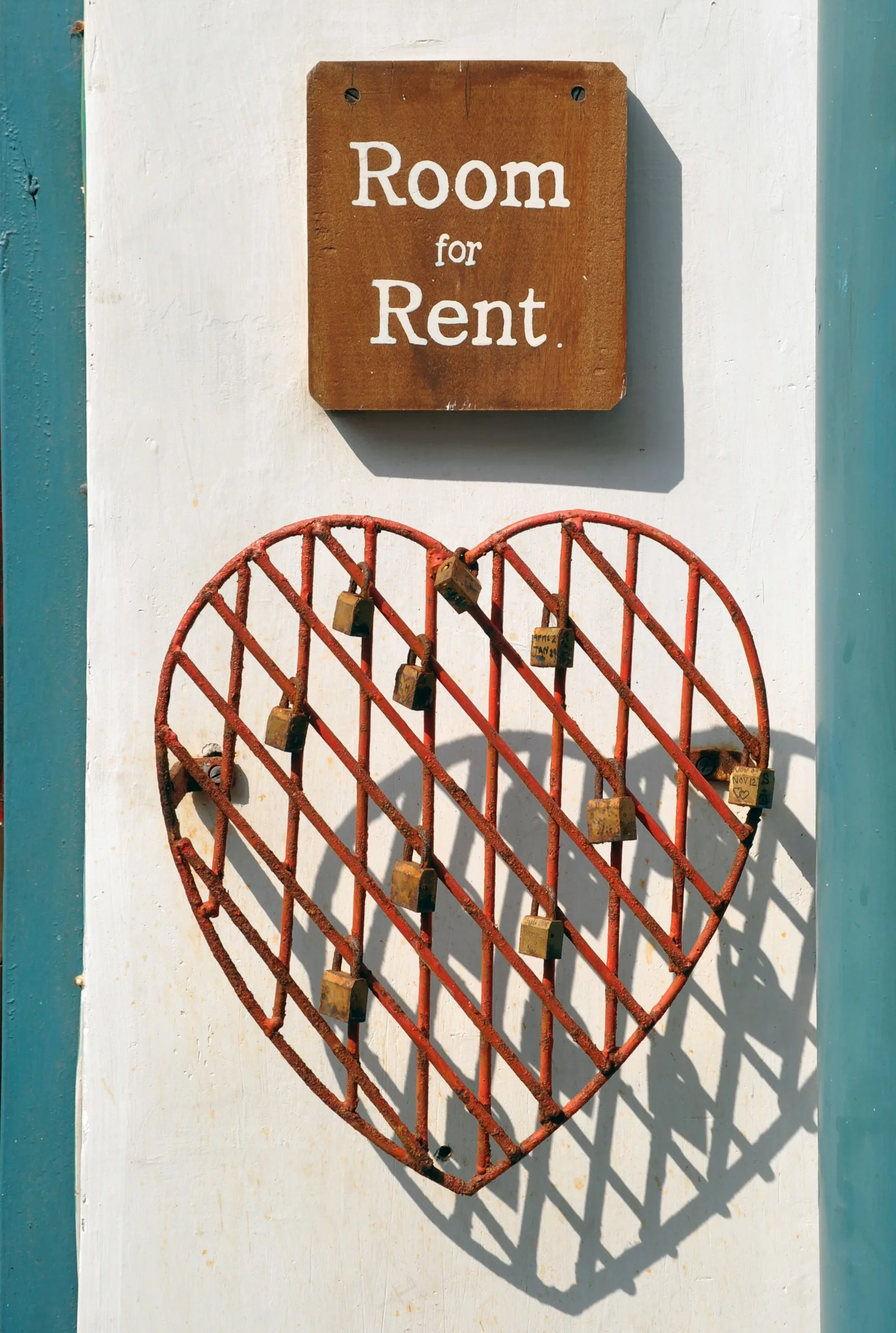 A sign showing “Room for Rent”