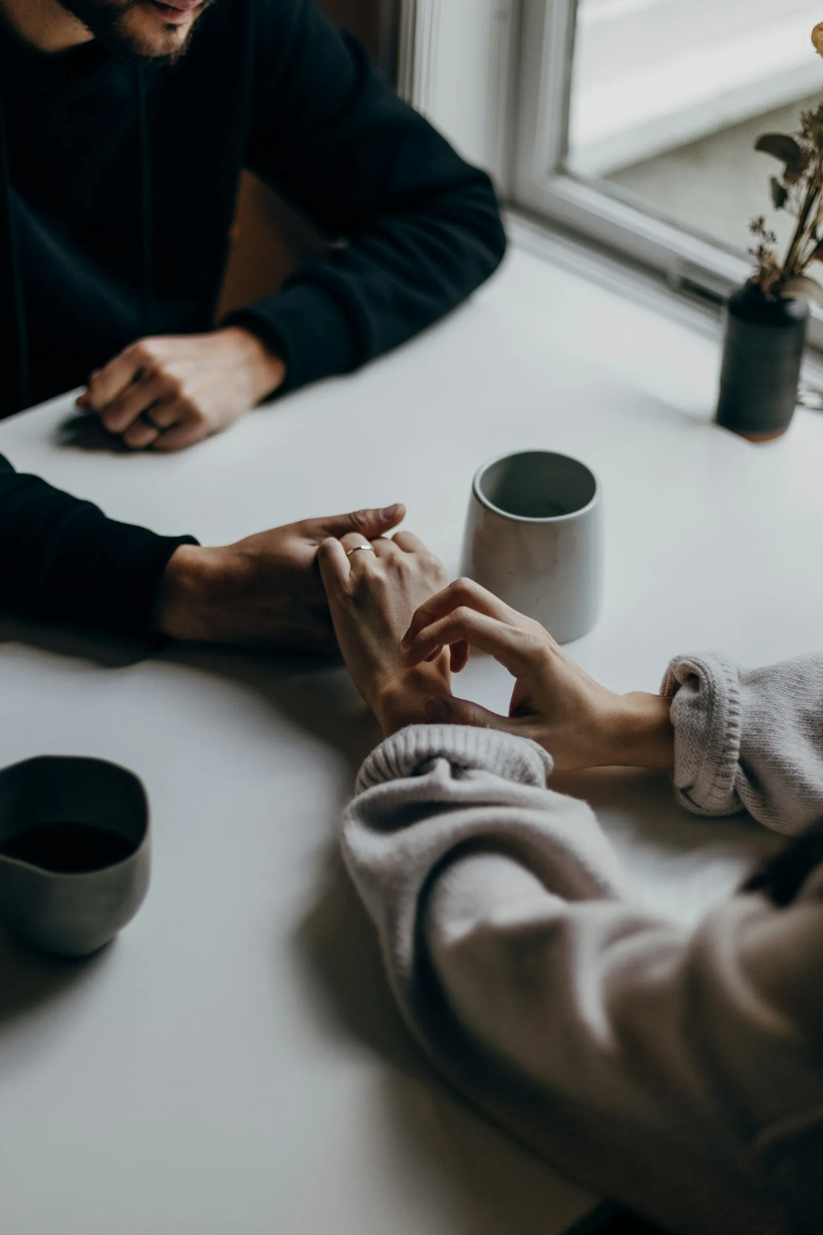 A couple doing difficult conversations, something that’s super important in order to strengthen the relationship and set clear expectations.