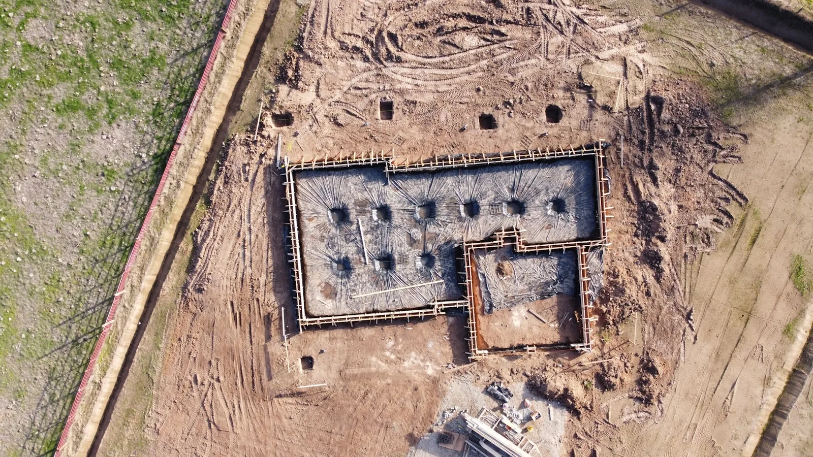 Photo of a foundation of a building that’s getting prepared, same as our 20s where we should start focusing on a strong foundation