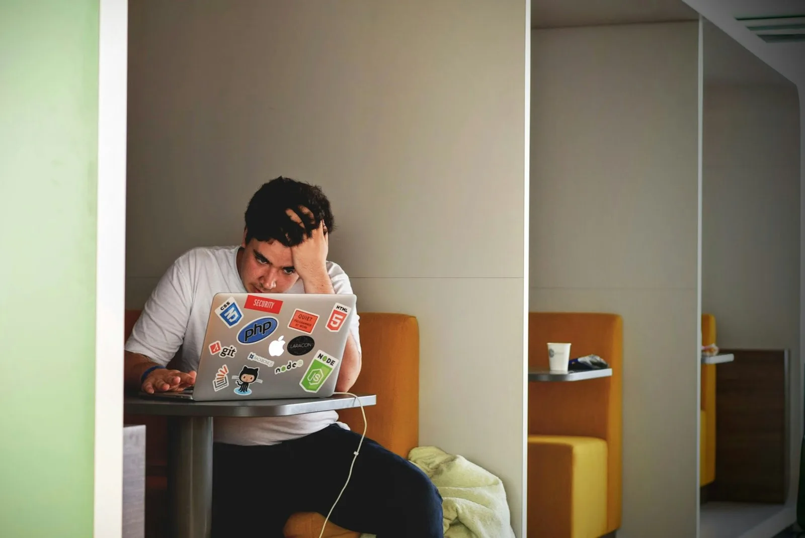 Photo of a student figuring out finances on a laptop