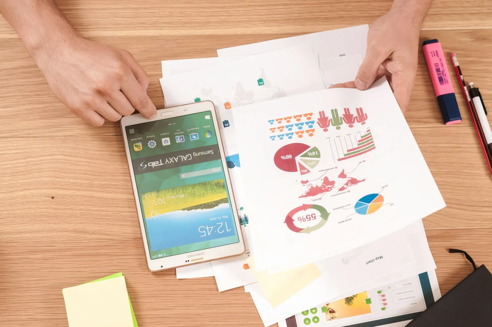A person reviewing past expenses and trends on a printed paper